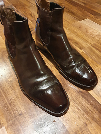 Pair of brown Russell & Bromley mens Chelsea boots after a shoeshine